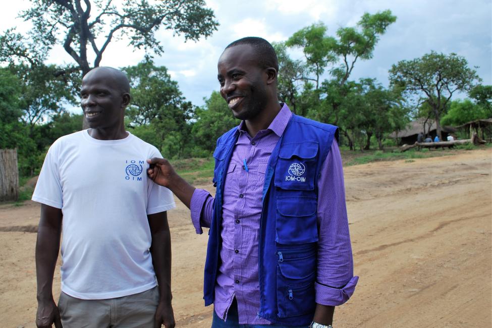Peter (right) and a colleague during a field monitoring visit in northern Uganda. Photo: IOM