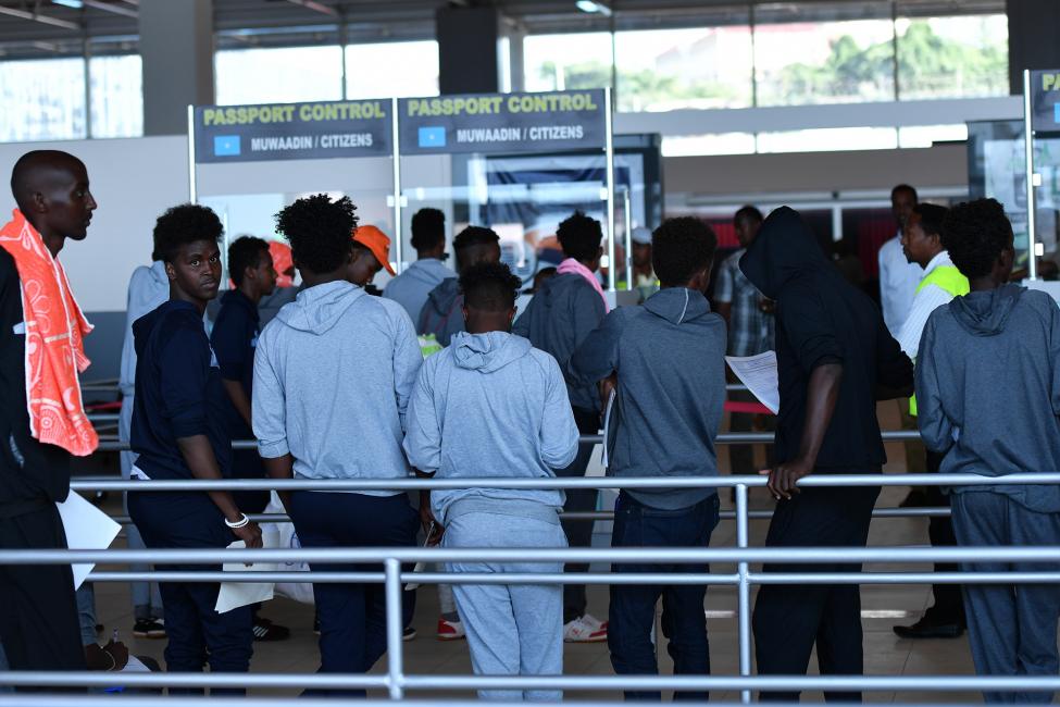 Somali migrants, once stranded in Libya, arrive home in Somalia via an IOM charter flight. Photo: UNSOM Somalia/2018