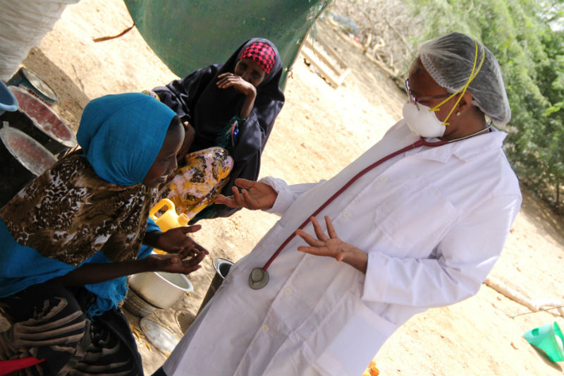 Dr. Damaris Miriti consulting with a TB patient at the MDRTB clinic in Dadaab.